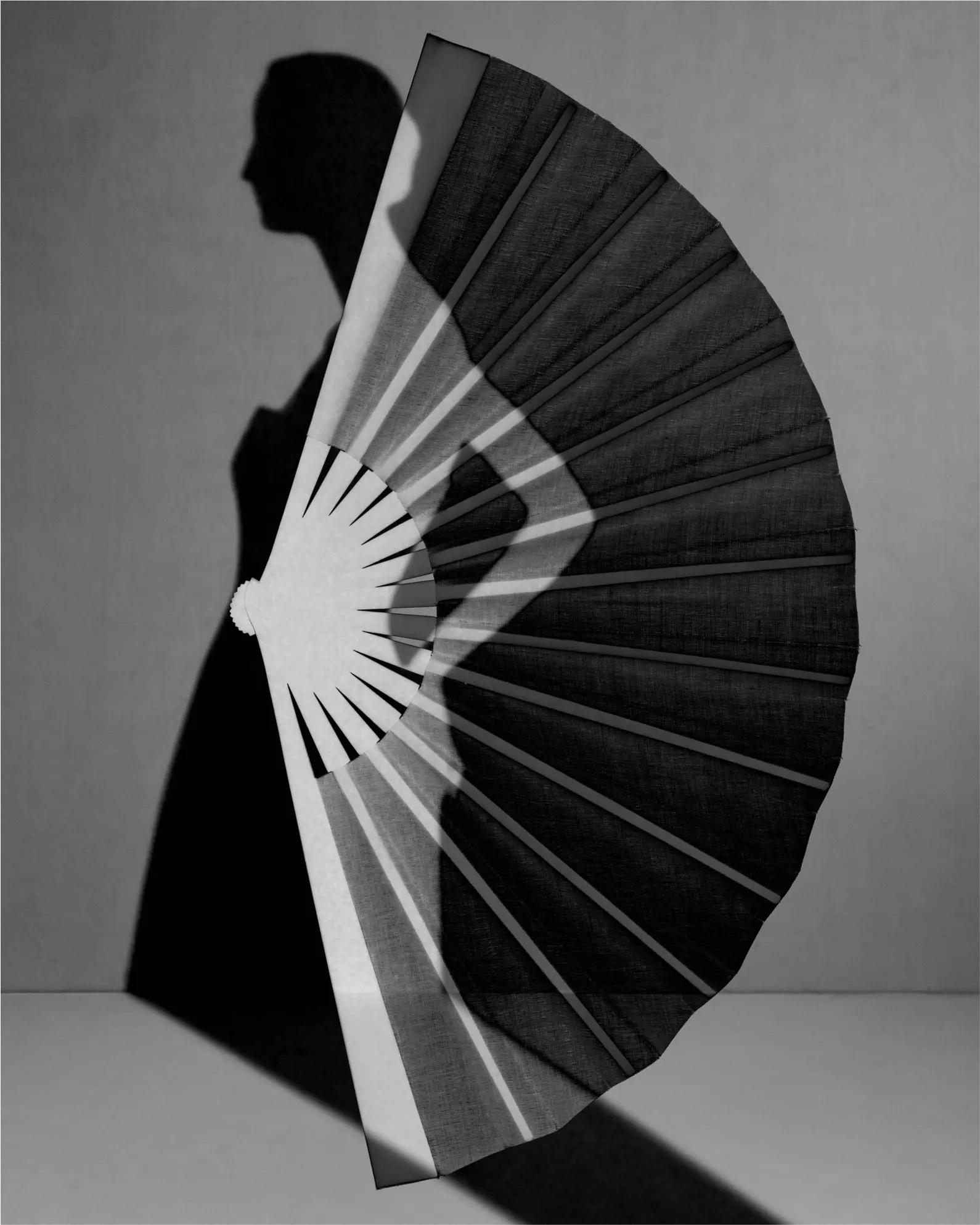Composite Image, 2023. Photographed by Julia Hetta. black and white composite image of women behind a fan