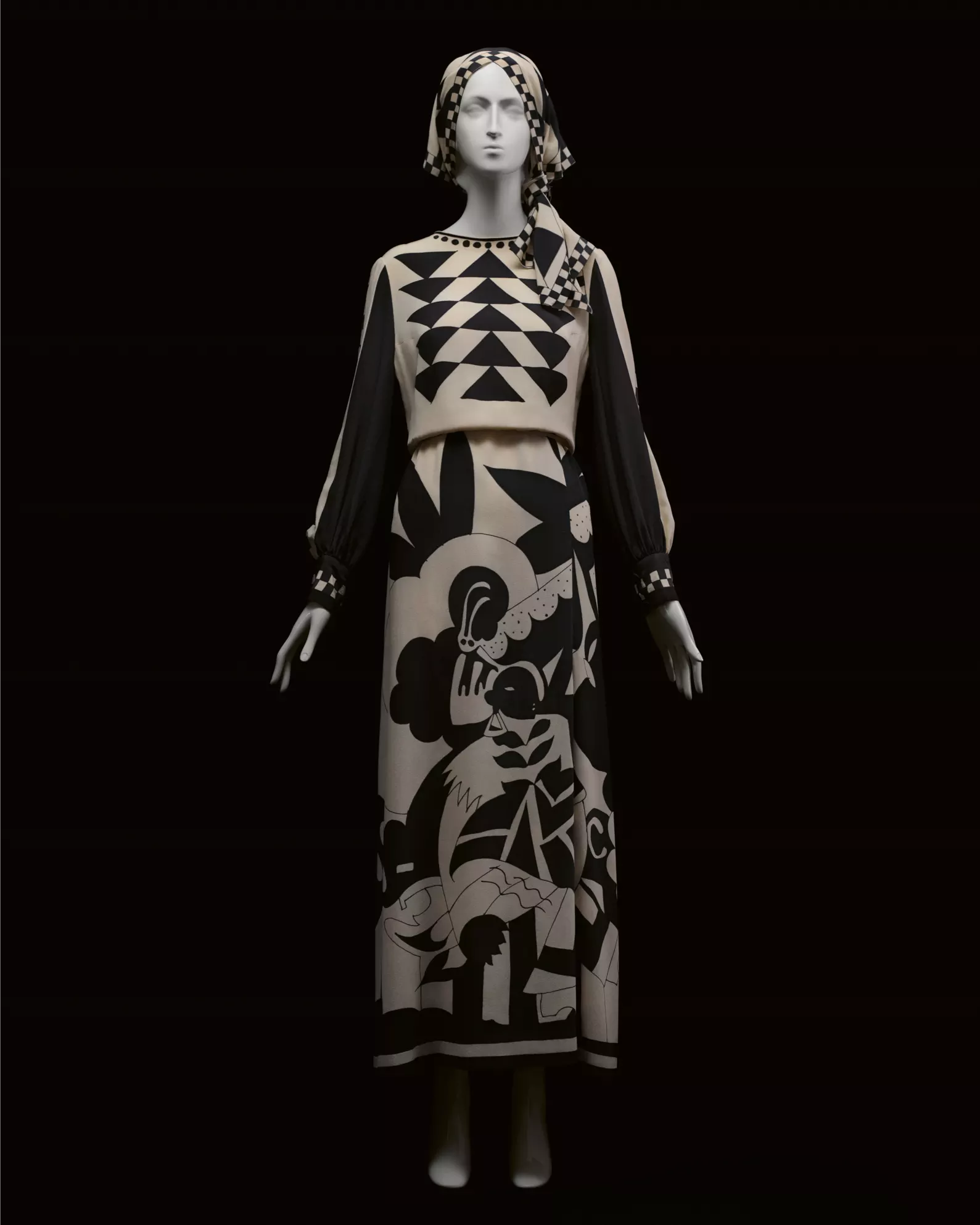mannequin dressed in black and white karl lagerfeld dress and head scarf