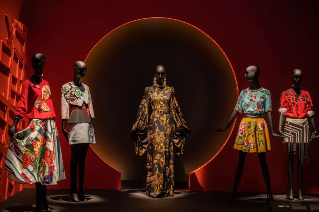 Dressed Schläppi female mannequins on a stage with a red background