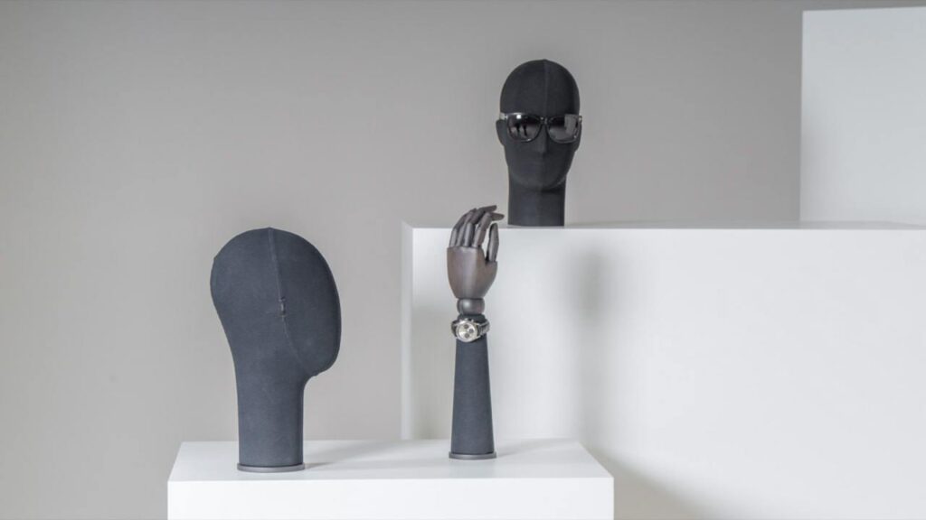 Male display heads and hands in dark fabric