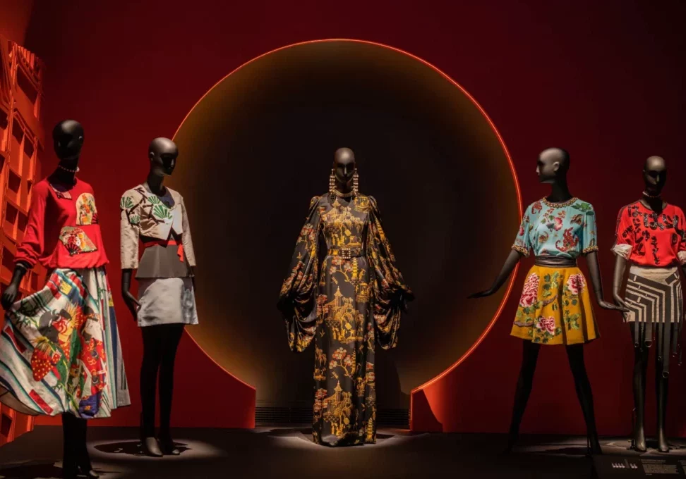 Dressed Schl&auml;ppi female mannequins on a stage with a red background