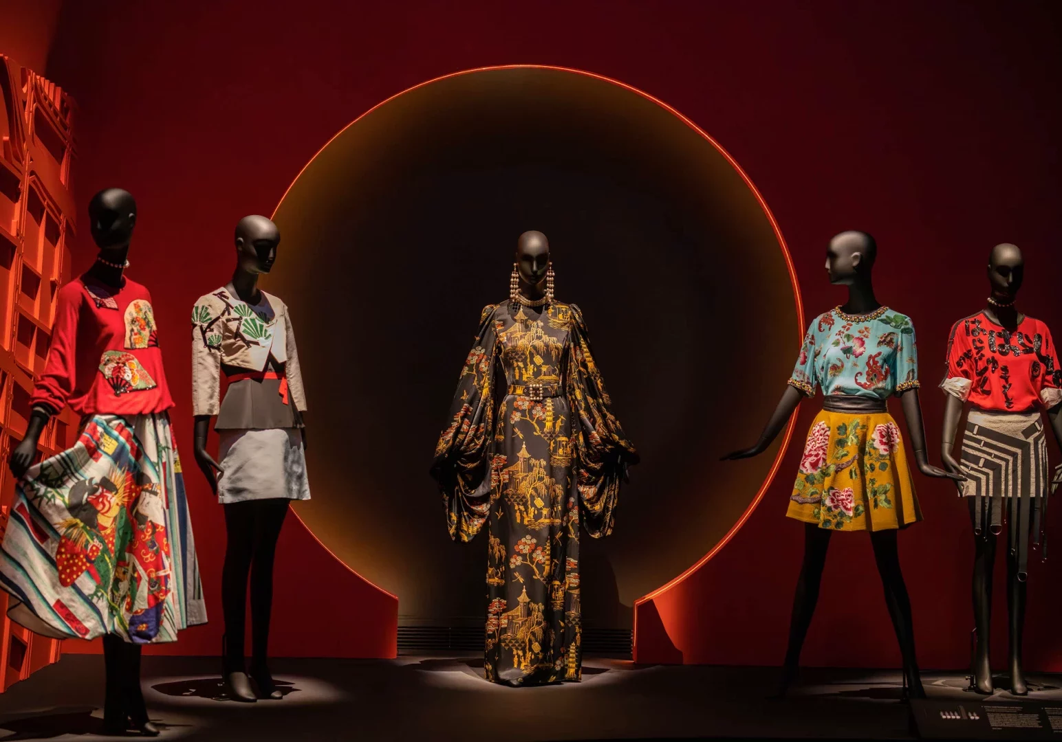 Dressed Schl&auml;ppi female mannequins on a stage with a red background