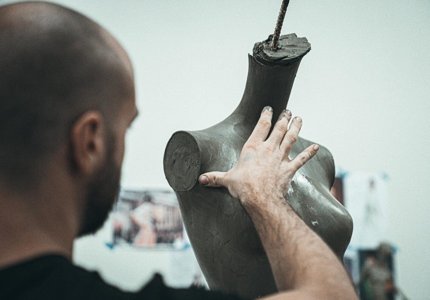 a sculptor creating a mannequin prototype