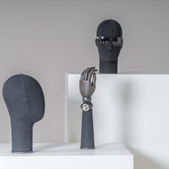 Male display heads and hands in dark fabric