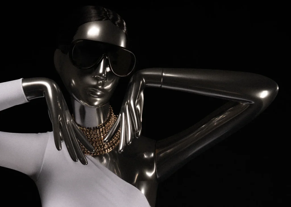 Close-up of a chrome Obsession mannequin with sunglasses, gold collar and both hands at the chin