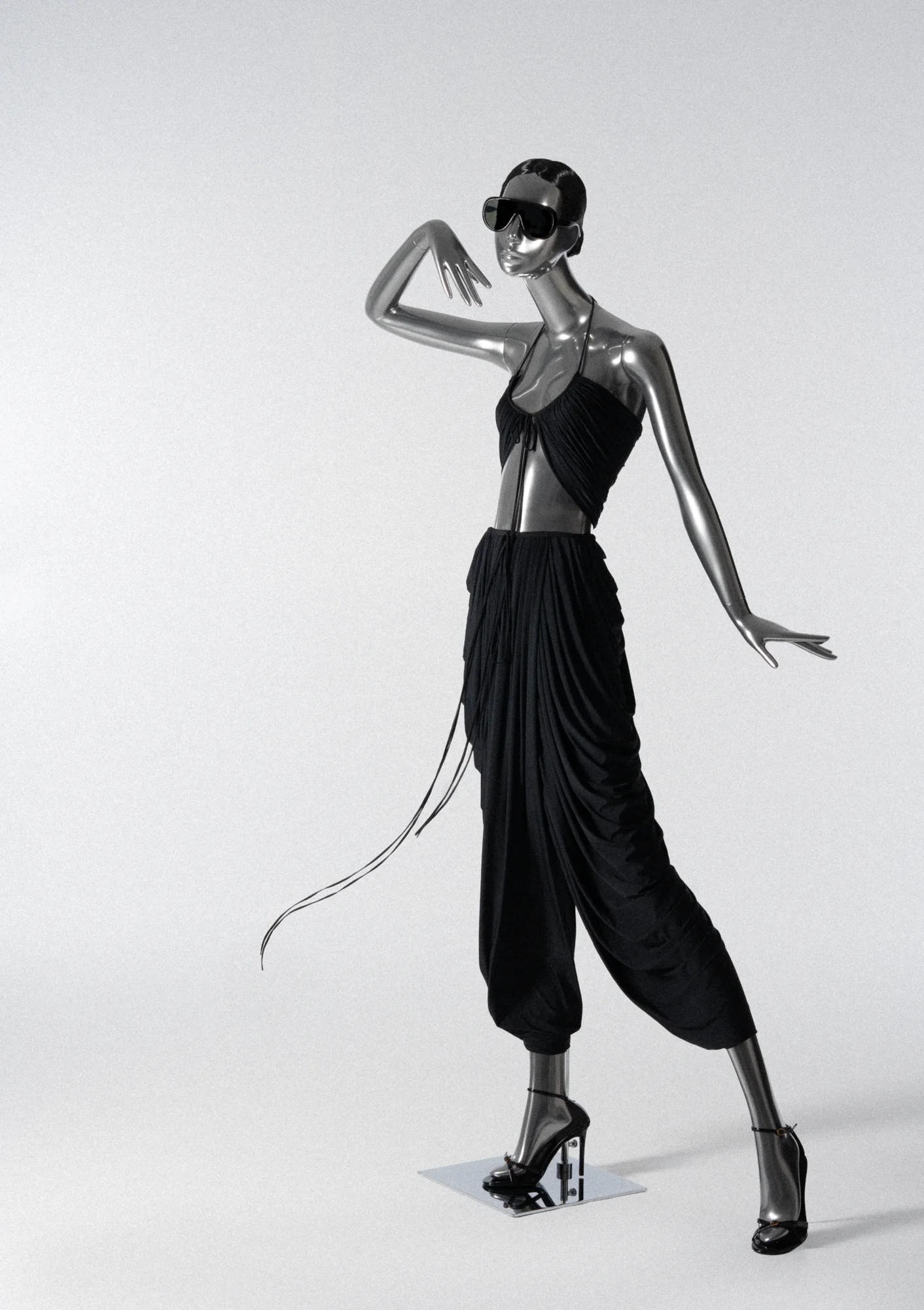 Chrome Obsession mannequin in a black draped top and trousers