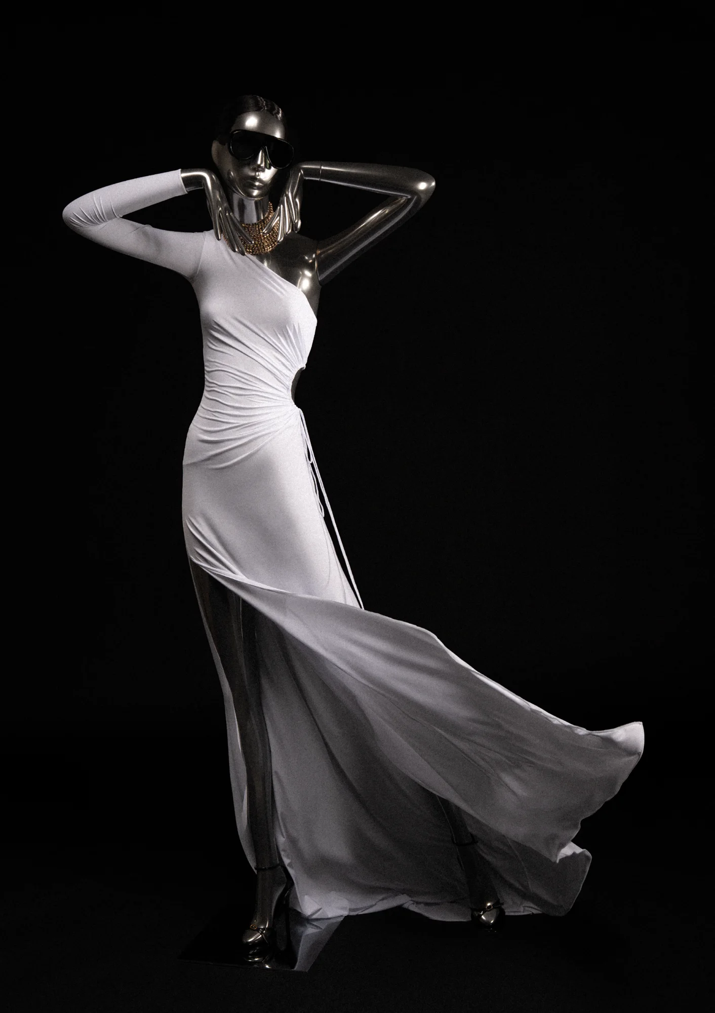Chrome Obsession mannequin in a white gown with hands raised to the chin