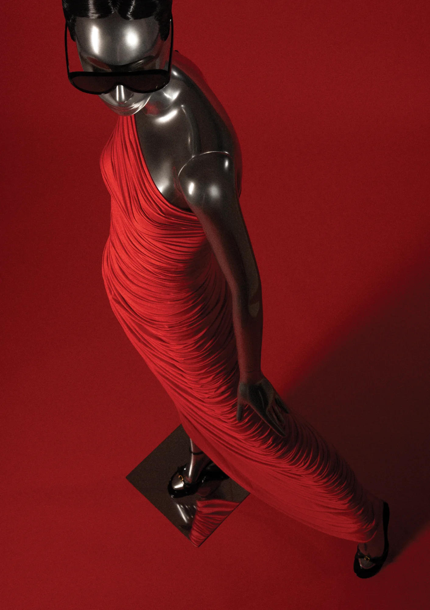 Chrome Obsession mannequin in a red ruched dress seen from above