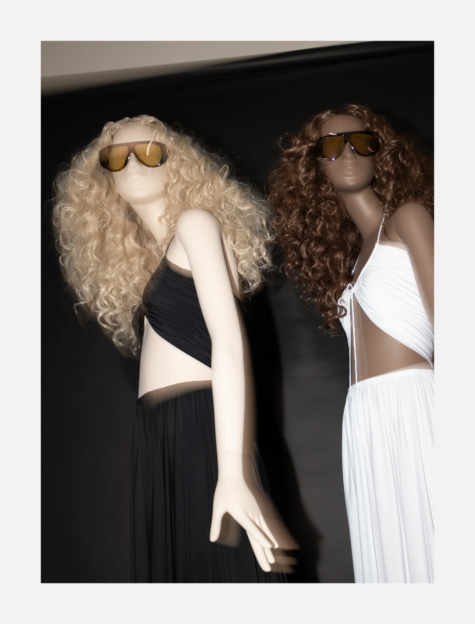 Two Obsession mannequins photographed from below