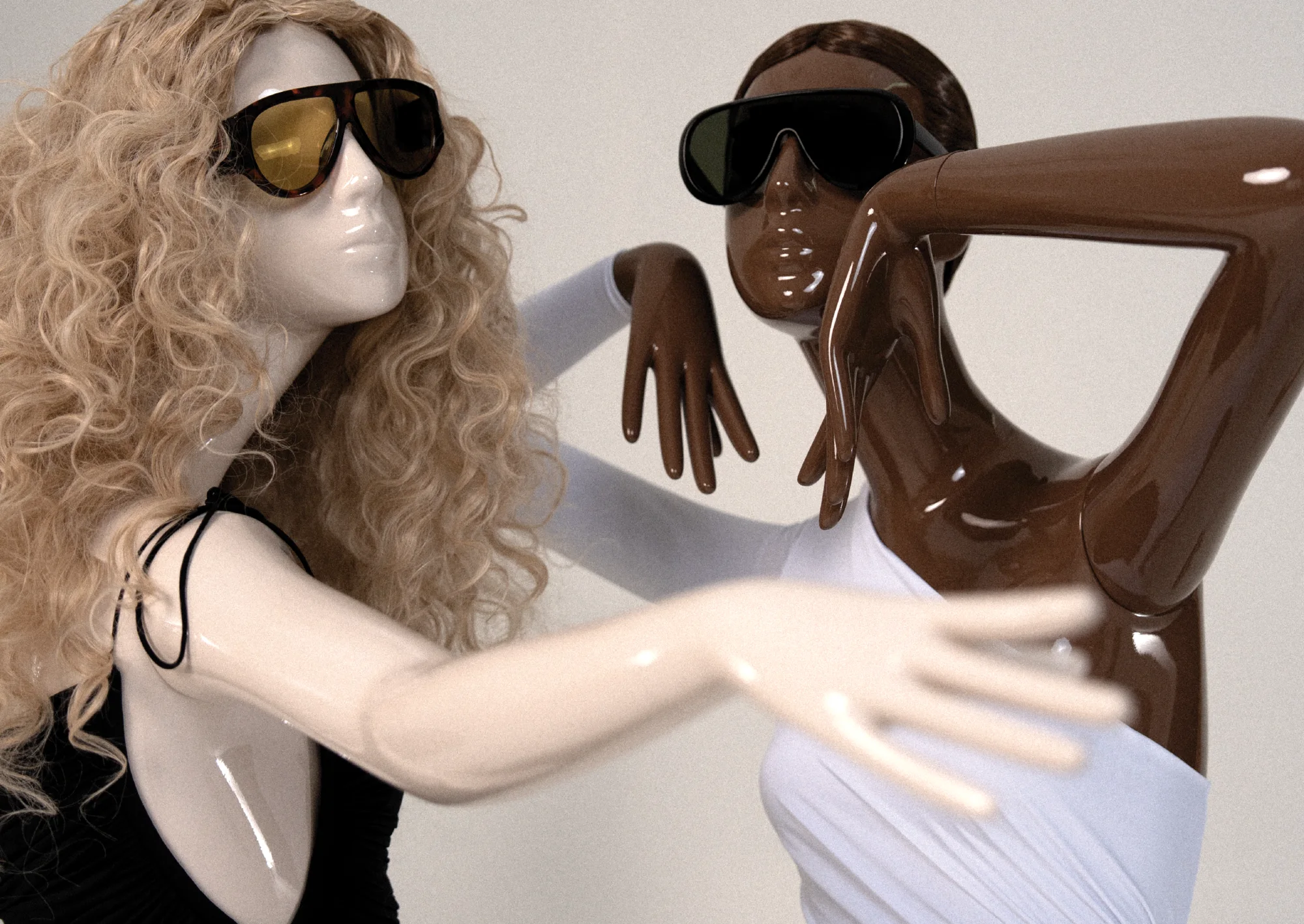 Close-up of two gloss Obsession mannequins with sunglasses